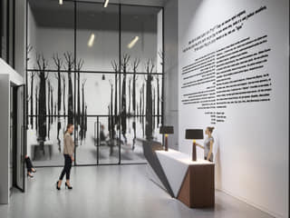 Museum reception with a forest graphic and multilingual wall text