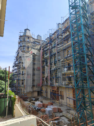 Construction photo of the facade under scaffolding