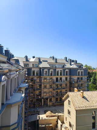Upper-level construction view across the residential courtyard